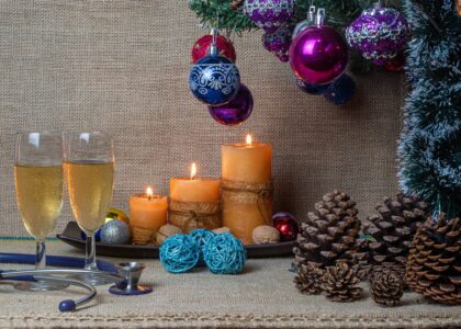 stethascope on a table surrounded by christmas decorations